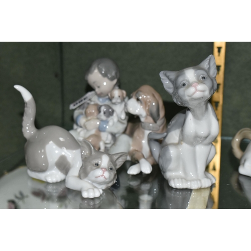 380 - THREE LLADRO FIGURES, comprising New Playmates model number 5456, depicting a boy, dog and puppies, ... 