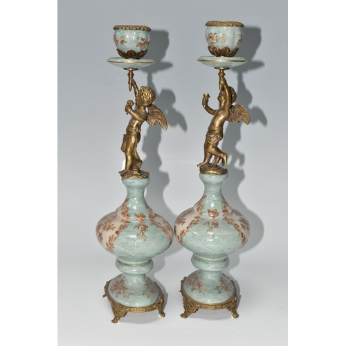 393 - A PAIR OF REPRODUCTION TURQUOISE PORCELAIN AND BRASS FIGURAL CANDLEHOLDERS OF LATE 19TH CENTURY STYL... 