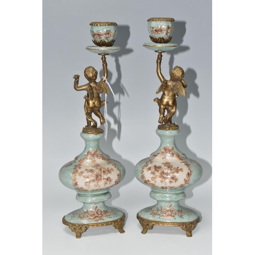 393 - A PAIR OF REPRODUCTION TURQUOISE PORCELAIN AND BRASS FIGURAL CANDLEHOLDERS OF LATE 19TH CENTURY STYL... 