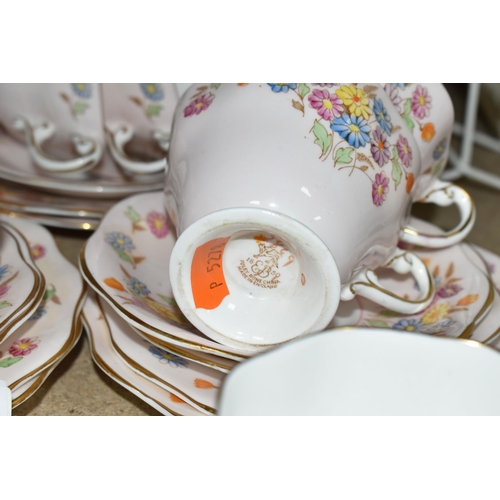 399 - A FOLEY BONE CHINA TEA SET PATTERN 2869, multicoloured meadow flowers on a pink ground, comprising a... 