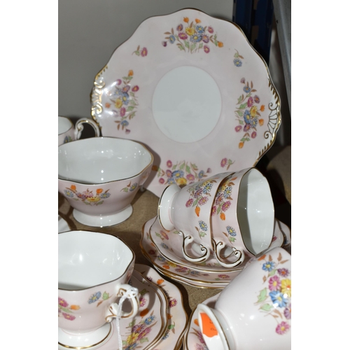 399 - A FOLEY BONE CHINA TEA SET PATTERN 2869, multicoloured meadow flowers on a pink ground, comprising a... 