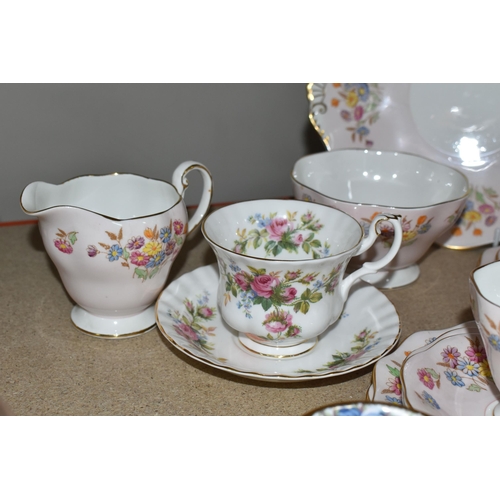 399 - A FOLEY BONE CHINA TEA SET PATTERN 2869, multicoloured meadow flowers on a pink ground, comprising a... 