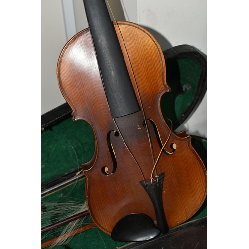 418 - TWO LATE 19TH CENTURY CASED VIOLINS, comprising violin needing attention, one piece back, a printed ... 