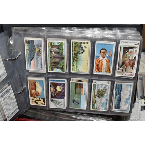 440 - CIGARETTE CARDS, a large collection of Cigarette Cards in eight albums, sleeves and loose containing... 