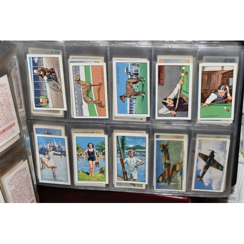 440 - CIGARETTE CARDS, a large collection of Cigarette Cards in eight albums, sleeves and loose containing... 