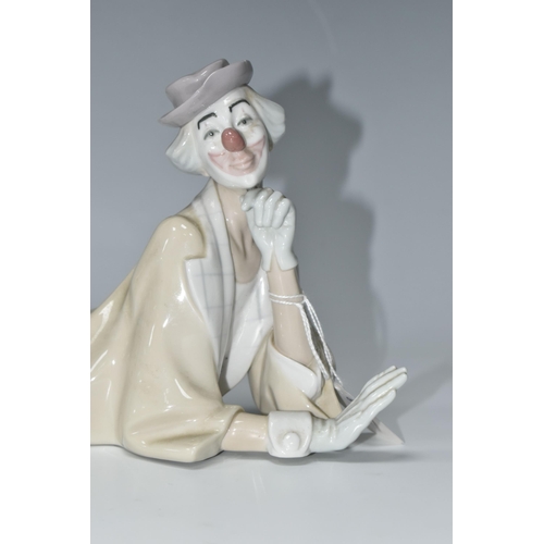 447 - A LLADRO CLOWN, no 4618, designed by Salvador Furio in 1970, the figure lying on his front with head... 