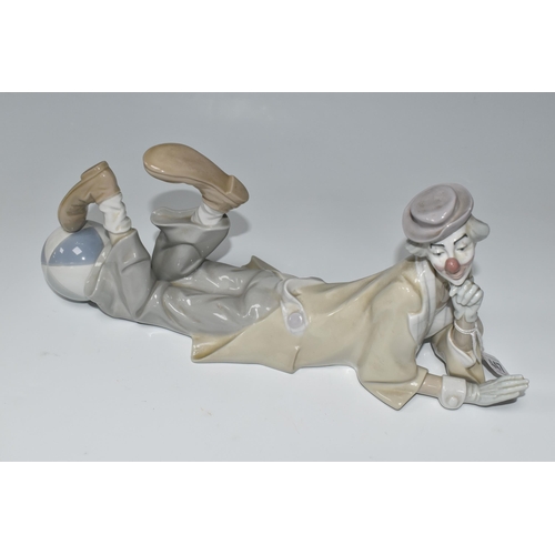 447 - A LLADRO CLOWN, no 4618, designed by Salvador Furio in 1970, the figure lying on his front with head... 