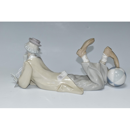 447 - A LLADRO CLOWN, no 4618, designed by Salvador Furio in 1970, the figure lying on his front with head... 