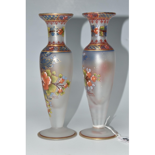 448 - TWO ATLANTIS GLASS FOOTED VASES, painted with flowers and foliate or geometric borders, having gilt ... 