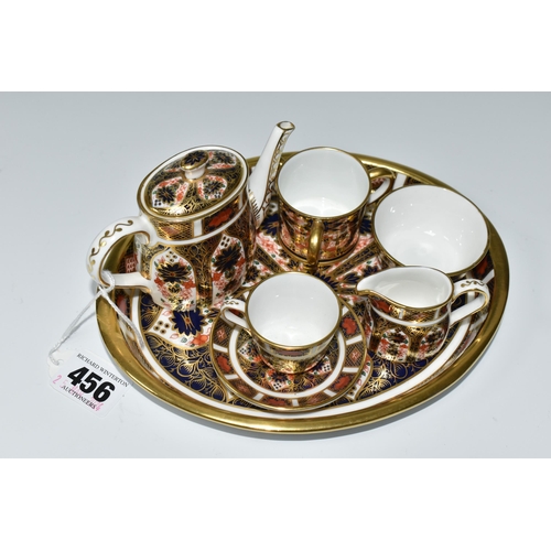 456 - A MINIATURE ROYAL CROWN DERBY IMARI 1128 TEA SET AND SERVING TRAY, comprising an oval serving tray, ... 