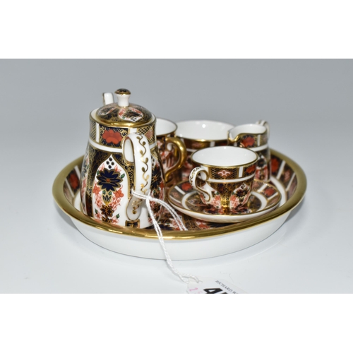 456 - A MINIATURE ROYAL CROWN DERBY IMARI 1128 TEA SET AND SERVING TRAY, comprising an oval serving tray, ... 