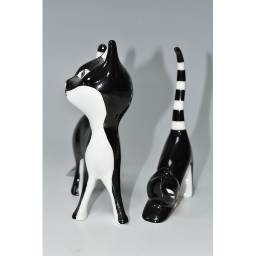 459 - TWO CMIELOW FIGURES OF BLACK AND WHITE CATS, the largest a standing cat with head tilted, model no 2... 