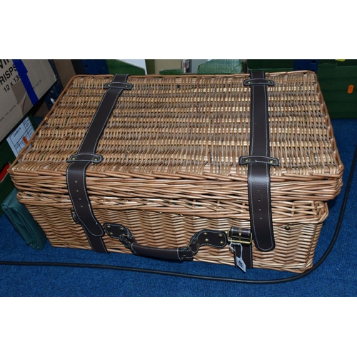 491 - A WICKER PICNIC HAMPER/SET, a large hamper containing a set of four wine glasses, four plates, cutle... 