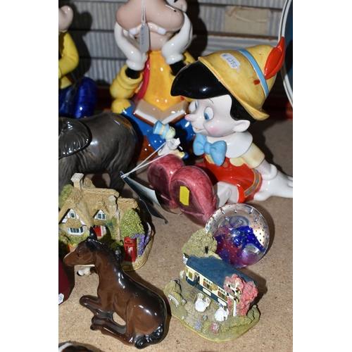 505 - A GROUP OF PAPERWEIGHTS AND ORNAMENTS, comprising three Schmid Disney Music Boxes, a Beswick Mare (F... 