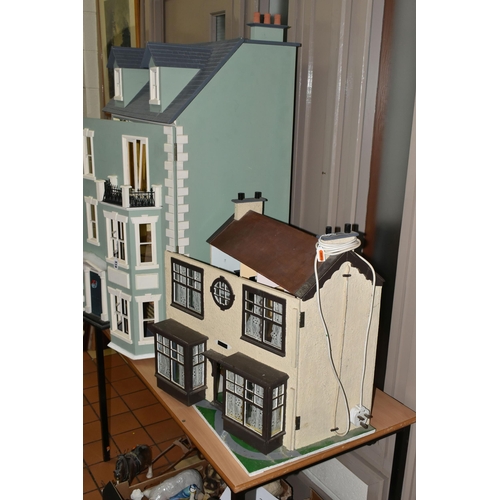 518 - TWO DOLL'S HOUSES, comprising a large Georgian kit built house, partially decorated, and a mid twent... 