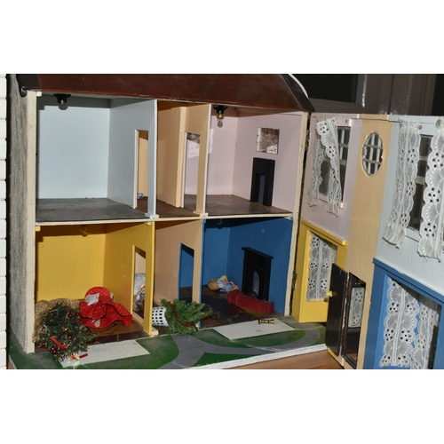 518 - TWO DOLL'S HOUSES, comprising a large Georgian kit built house, partially decorated, and a mid twent... 