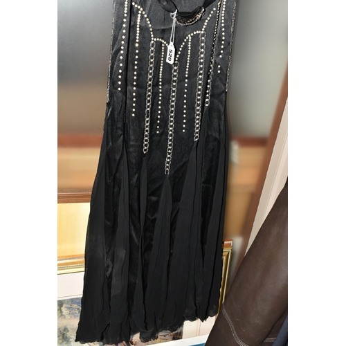 520 - A 1920'S/30'S BLACK SATIN AND CHIFFON COCKTAIL DRESS, together with a pair of long powder blue kid l... 