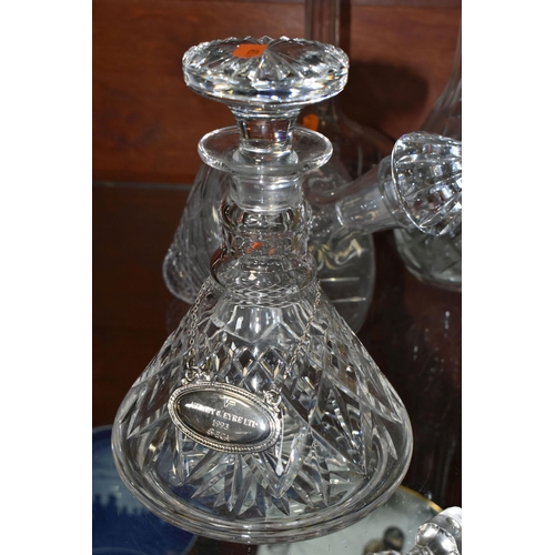 535 - A GROUP OF DECANTERS AND STOPPERS, comprising a square decanter with silver collar, hallmarked Birmi... 