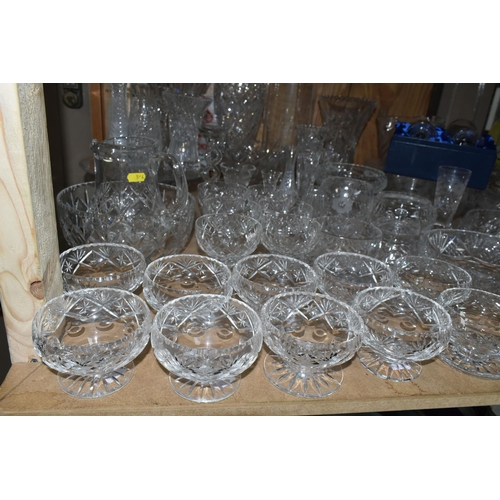 544 - A LARGE QUANTITY OF CUT CRYSTAL AND GLASSWARE, comprising a David Whyman glass vase depicting a nigh... 