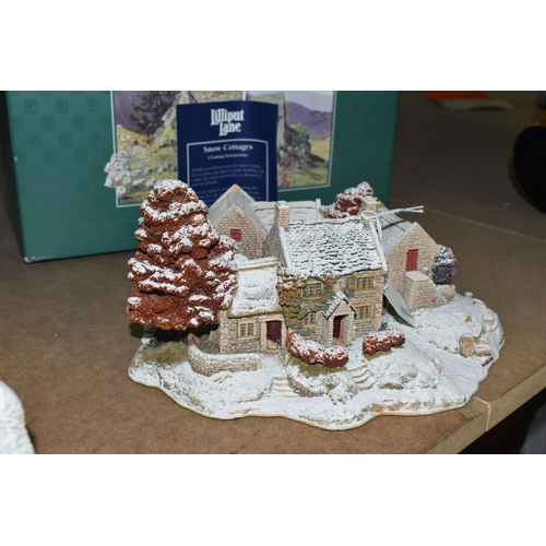 555 - TWO BOXED LILLIPUT LANE SNOW COTTAGES, comprising a limited edition ' First Snow At Bluebell'  2485/... 