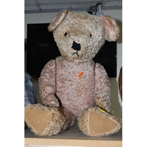 561 - FOUR VINTAGE JOINTED TEDDY BEARS, comprising a golden plush bear with a growler requiring attention ... 