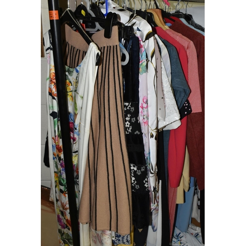 590 - A GROUP OF THIRTY SEVEN ITEMS OF WOMEN'S CLOTHING, dresses, skirts, and two jackets, to include a bl... 