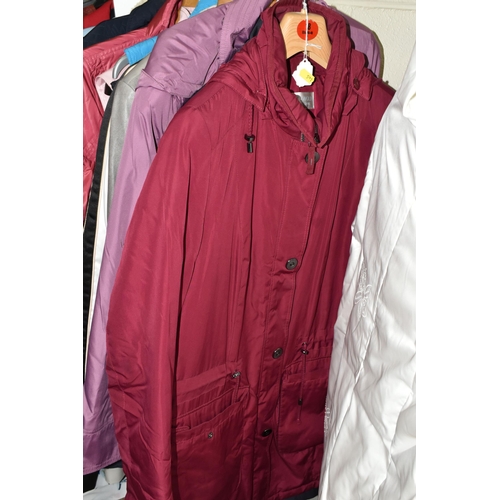 591 - A GROUP TWENTY TWO LADIES' JACKETS, GILETS AND COATS, comprising three modern 'sheepskin' coats, a s... 