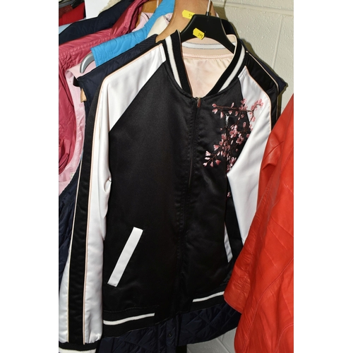 591 - A GROUP TWENTY TWO LADIES' JACKETS, GILETS AND COATS, comprising three modern 'sheepskin' coats, a s... 