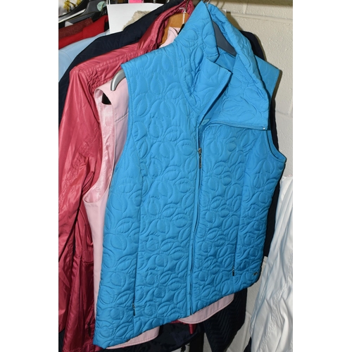 591 - A GROUP TWENTY TWO LADIES' JACKETS, GILETS AND COATS, comprising three modern 'sheepskin' coats, a s... 