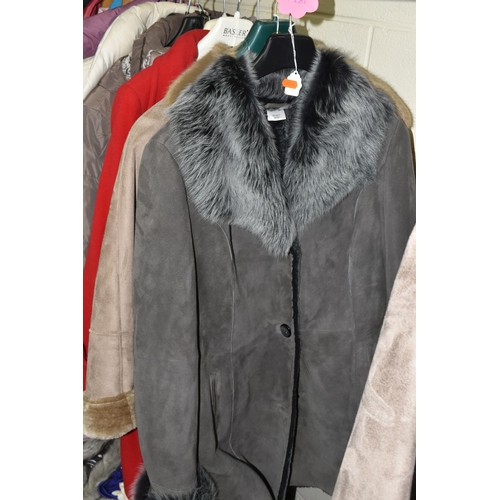 591 - A GROUP TWENTY TWO LADIES' JACKETS, GILETS AND COATS, comprising three modern 'sheepskin' coats, a s... 