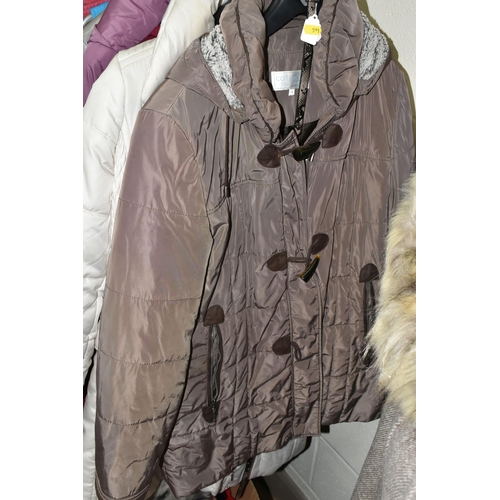 591 - A GROUP TWENTY TWO LADIES' JACKETS, GILETS AND COATS, comprising three modern 'sheepskin' coats, a s... 