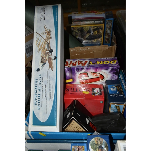 624 - THREE BOXES OF JIGSAWS AND BOARD GAMES, to include two sealed Gibsons jigsaws, sealed HOP jigsaw and... 