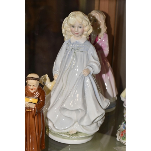 628 - EIGHT FIGURINES OF GIRLS, LADIES AND FATHER CHRISTMAS, ETC, comprising a set of three Royal Doulton ... 