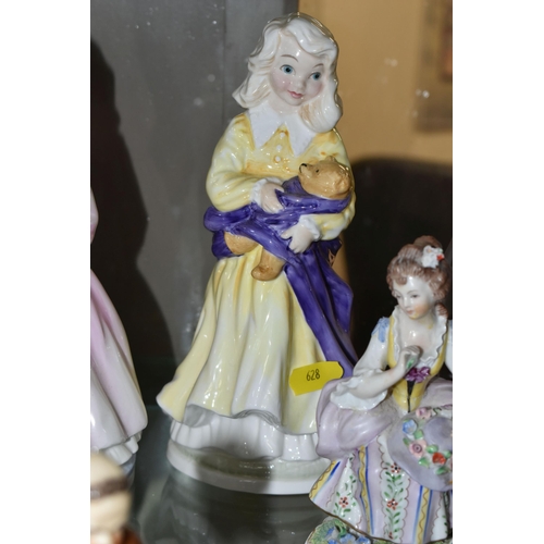 628 - EIGHT FIGURINES OF GIRLS, LADIES AND FATHER CHRISTMAS, ETC, comprising a set of three Royal Doulton ... 