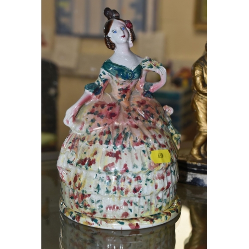 639 - TWO 19TH CENTURY STAFFORDSHIRE LADIES BOUDOIR POTS, crinoline ladies with pots underneath the skirt ... 