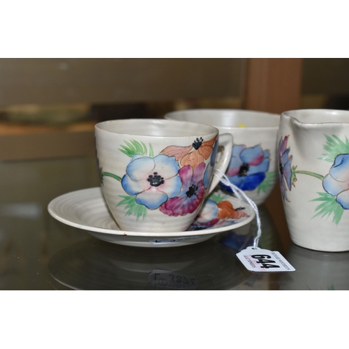 644 - A SIX PIECE CLARICE CLIFF 'ANEMONE' PART TEA SET, comprising two teacups and saucers, a cream jug an... 