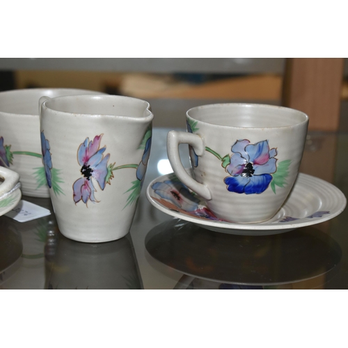 644 - A SIX PIECE CLARICE CLIFF 'ANEMONE' PART TEA SET, comprising two teacups and saucers, a cream jug an... 