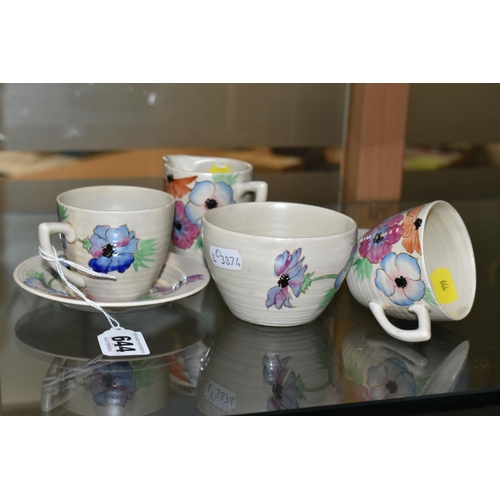 644 - A SIX PIECE CLARICE CLIFF 'ANEMONE' PART TEA SET, comprising two teacups and saucers, a cream jug an... 