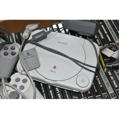 696 - A SONY PLAYSTATION ONE CONSOLE AND GAMES, has over fifty games including Crash Bandicoot (big box), ... 