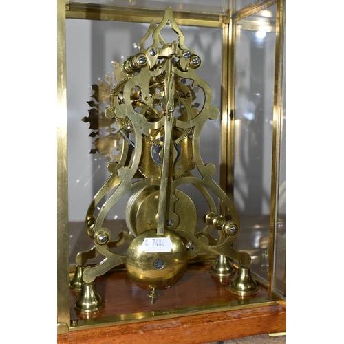 342 - A GLASS CASED VICTORIAN BRASS FUSEE SKELETON CLOCK, the arch shaped clock with silvered chapter ring... 