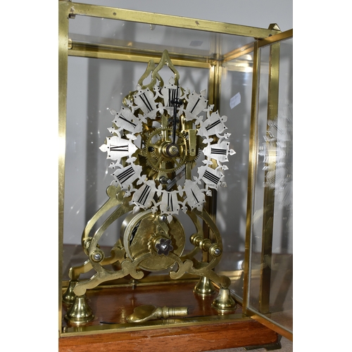 342 - A GLASS CASED VICTORIAN BRASS FUSEE SKELETON CLOCK, the arch shaped clock with silvered chapter ring... 