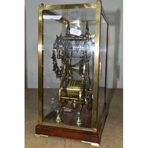 342 - A GLASS CASED VICTORIAN BRASS FUSEE SKELETON CLOCK, the arch shaped clock with silvered chapter ring... 