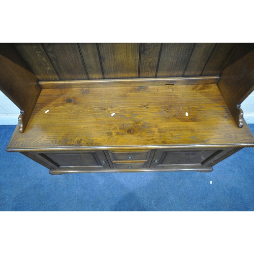 1190 - A GOOD QUALITY REPRODUCTION ELM DRESSER, the top two tier bookcase, atop a base that's fitted with t... 