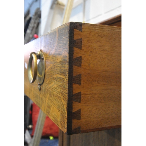 1257 - A 20TH CENTURY OAK SIDEBOARD, with a raised back, two drawers, above two cupboard doors, length 168c... 