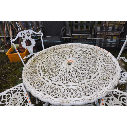 1008 - A WHITE PAINTED CAST ALUMINIUM GARDEN TABLE, table diameter 92cm, and four chairs (5)