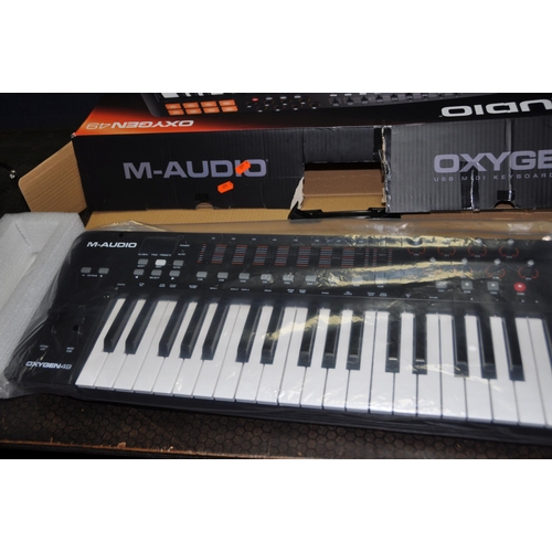 1052 - A M AUDIO OXYGEN 49 MIDI KEYBOARD CONTROLLER in original box (UNTESTED but looks unused)