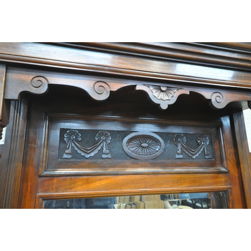 1332 - AN EDWARDIAN MAHOGANY MIRROR BACK SIDEBOARD, the top with three bevelled mirror plates, scrolled and... 