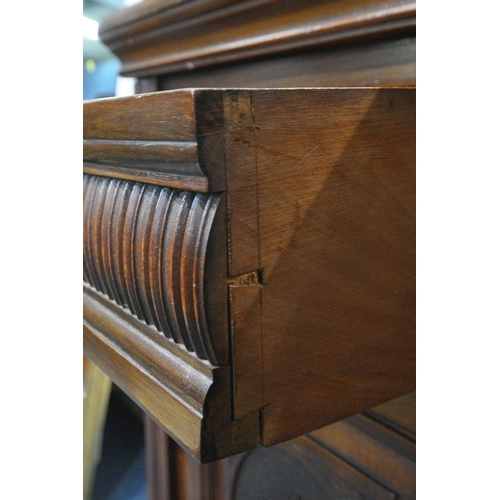 1332 - AN EDWARDIAN MAHOGANY MIRROR BACK SIDEBOARD, the top with three bevelled mirror plates, scrolled and... 