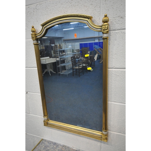 1340 - A FRENCH STYLE CREAM AND GILT CONSOLE TABLE, with a reflective insert, foliate decoration, on cylind... 