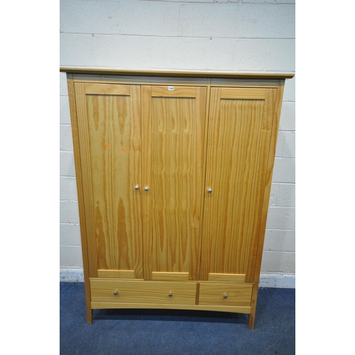 1345 - A MODERN PINE TRIPLE DOOR WARDROBE, with two drawers, width 139cm x depth 54cm x height 188cm (condi... 